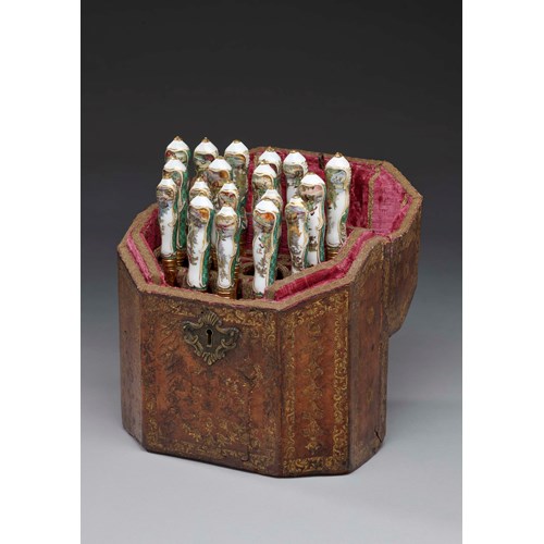 A cutlery set for six persons, decorated with hunting scenes and green-mosaic ground in its original leather case 